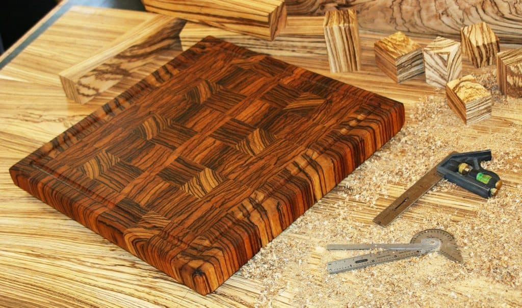 brown end grain butcher block on wood shop table