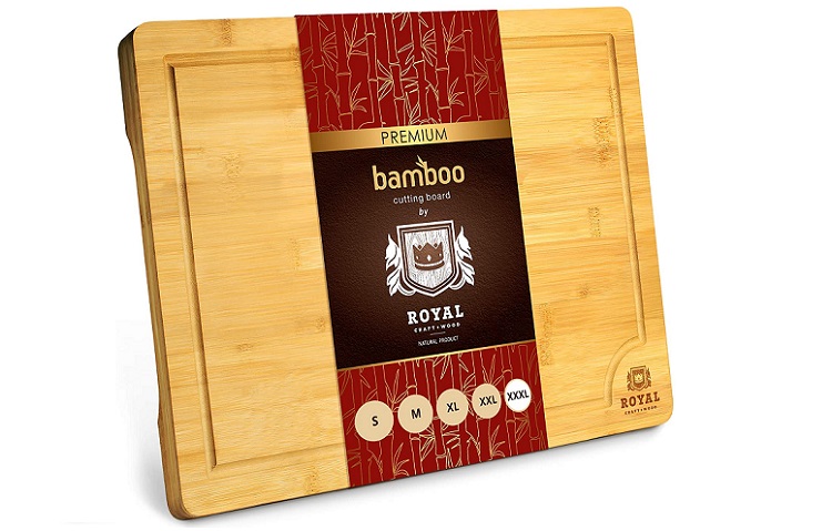 bamboo cutting board with wrapping still on center of it