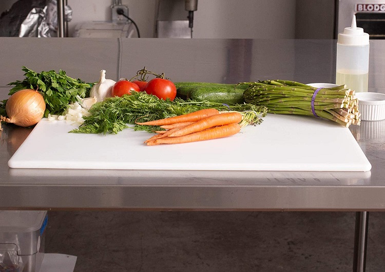 various veggies on cutting board in kitchen