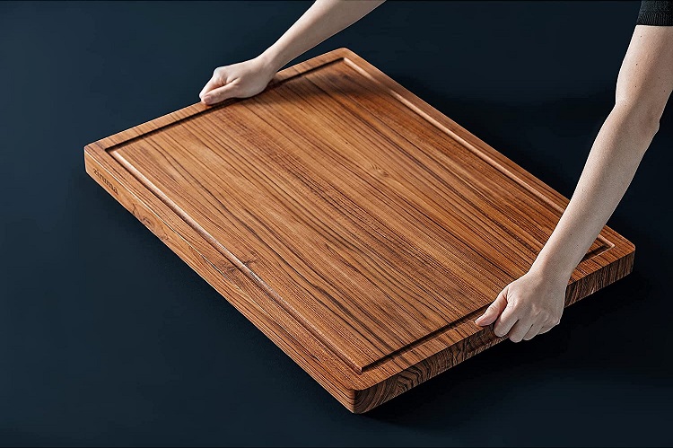 very large cutting board being held by human hands
