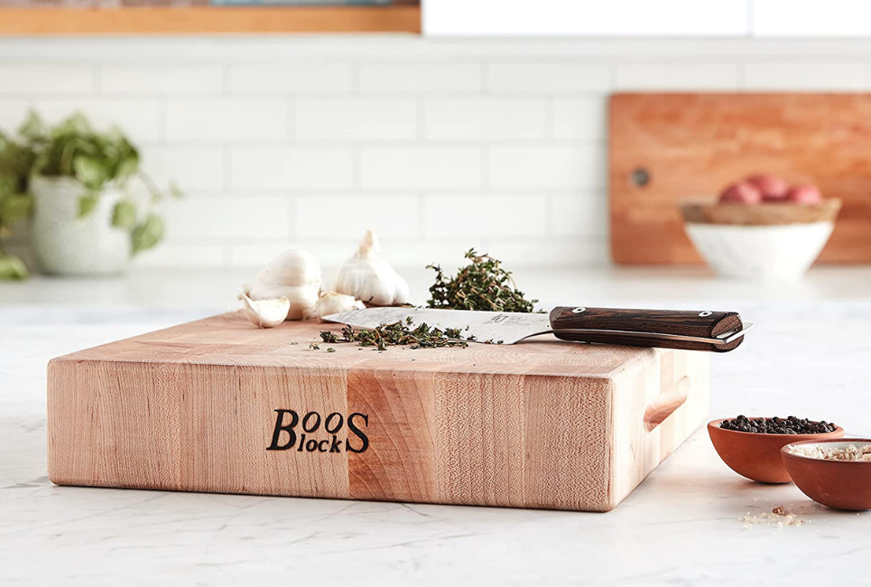 food on thick BOOS brand cutting board in kitchen