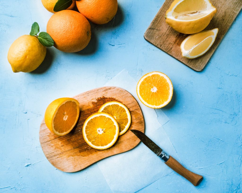 small cutting board with slices of oranges
