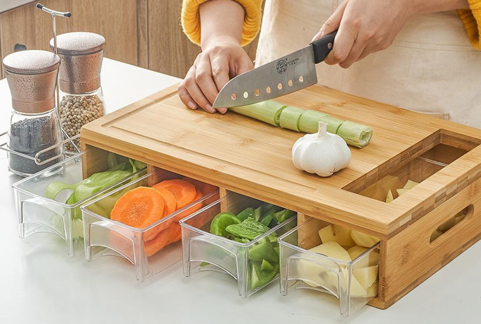 cutting board with vegetables and containers