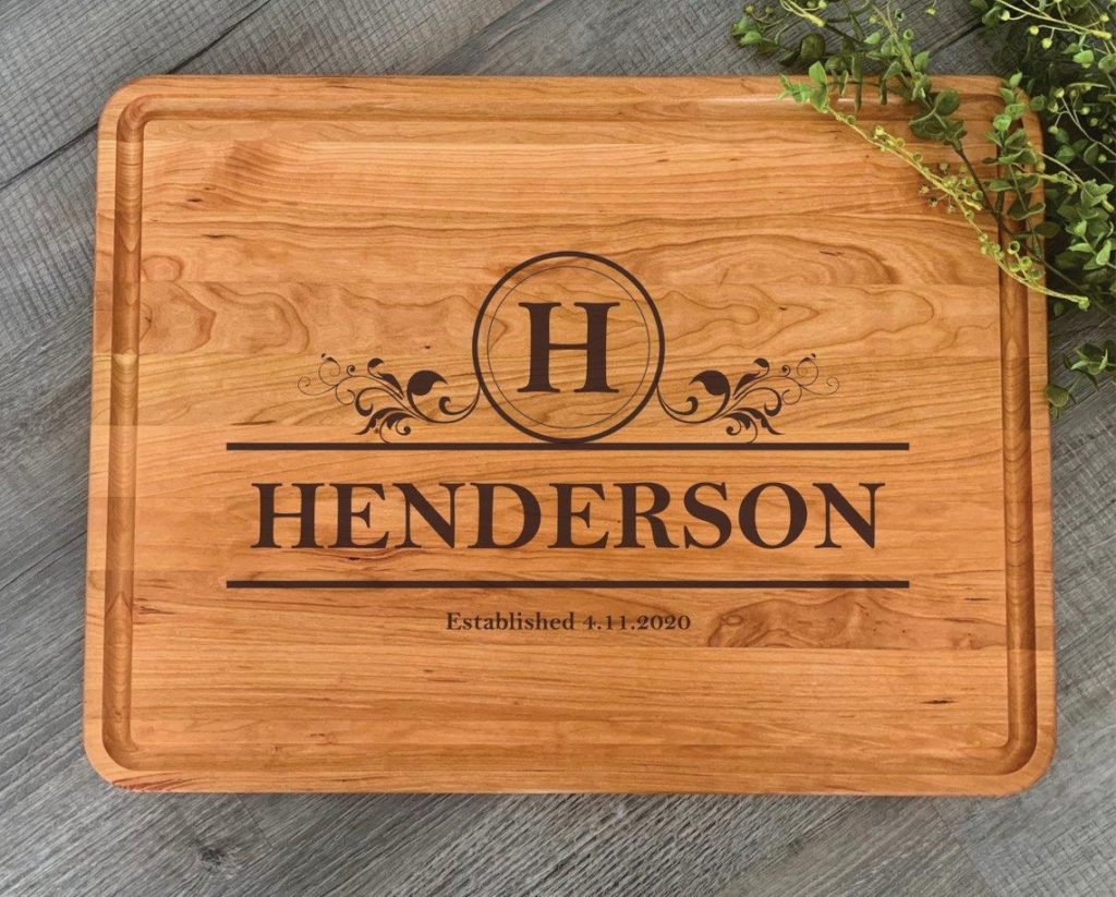 rectangular wooden cutting board with henderson engraved