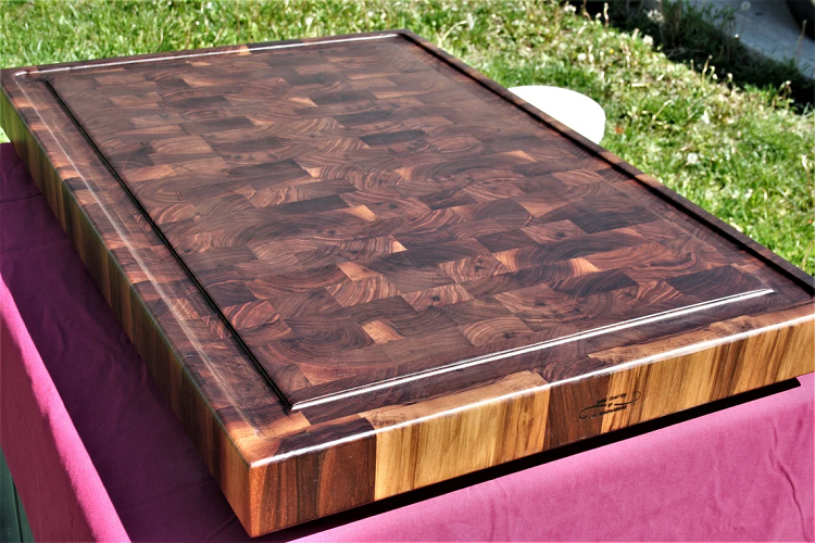 large walnut cutting board outside