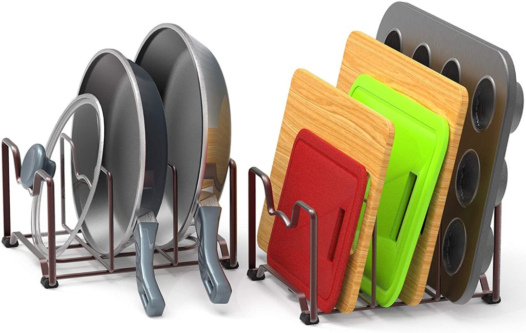 assorted cookware in two bronze metal storage racks