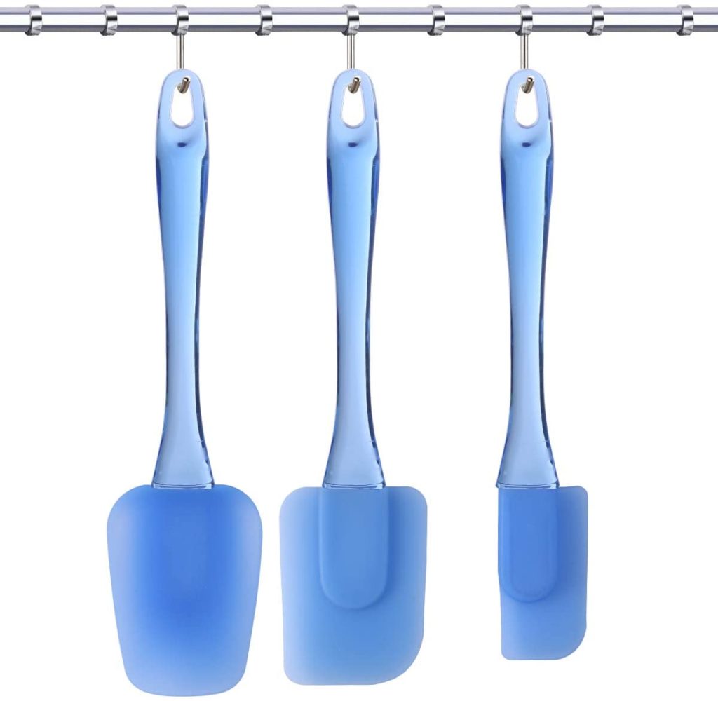 three hanging blue silicone spatulas with plastic handles