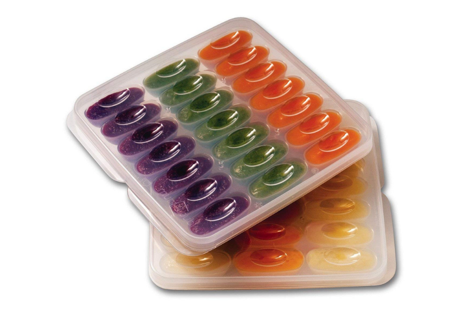 tray containers with colorful baby food puree