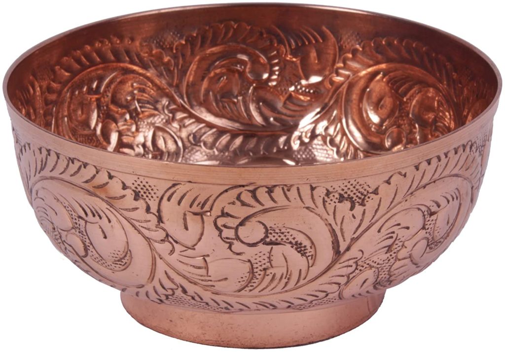 hammered floral patterned copper bowl