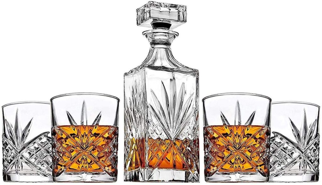 crystal whiskey decanter with matching four glasses