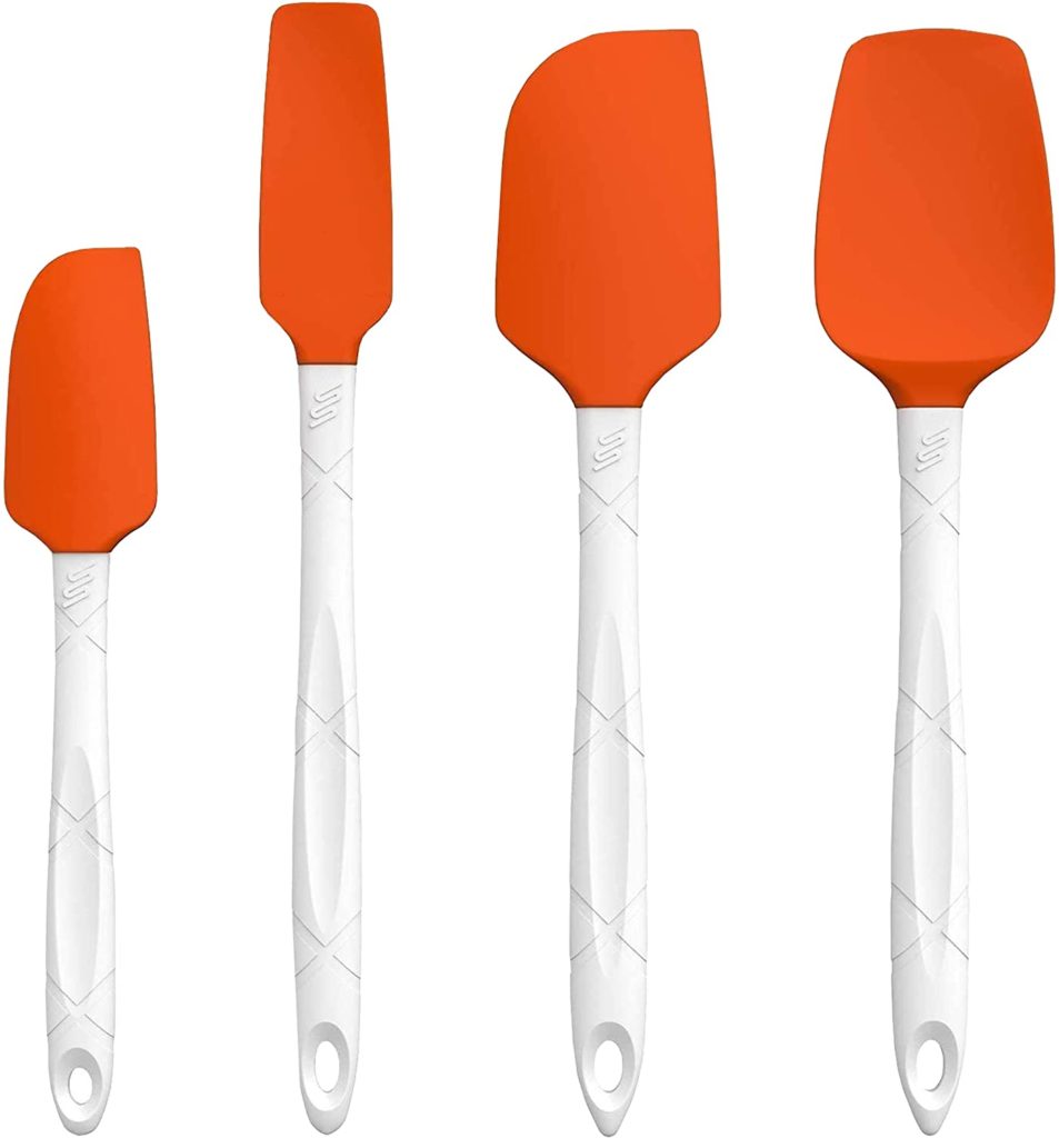 white and orange bowl scraper spatulas