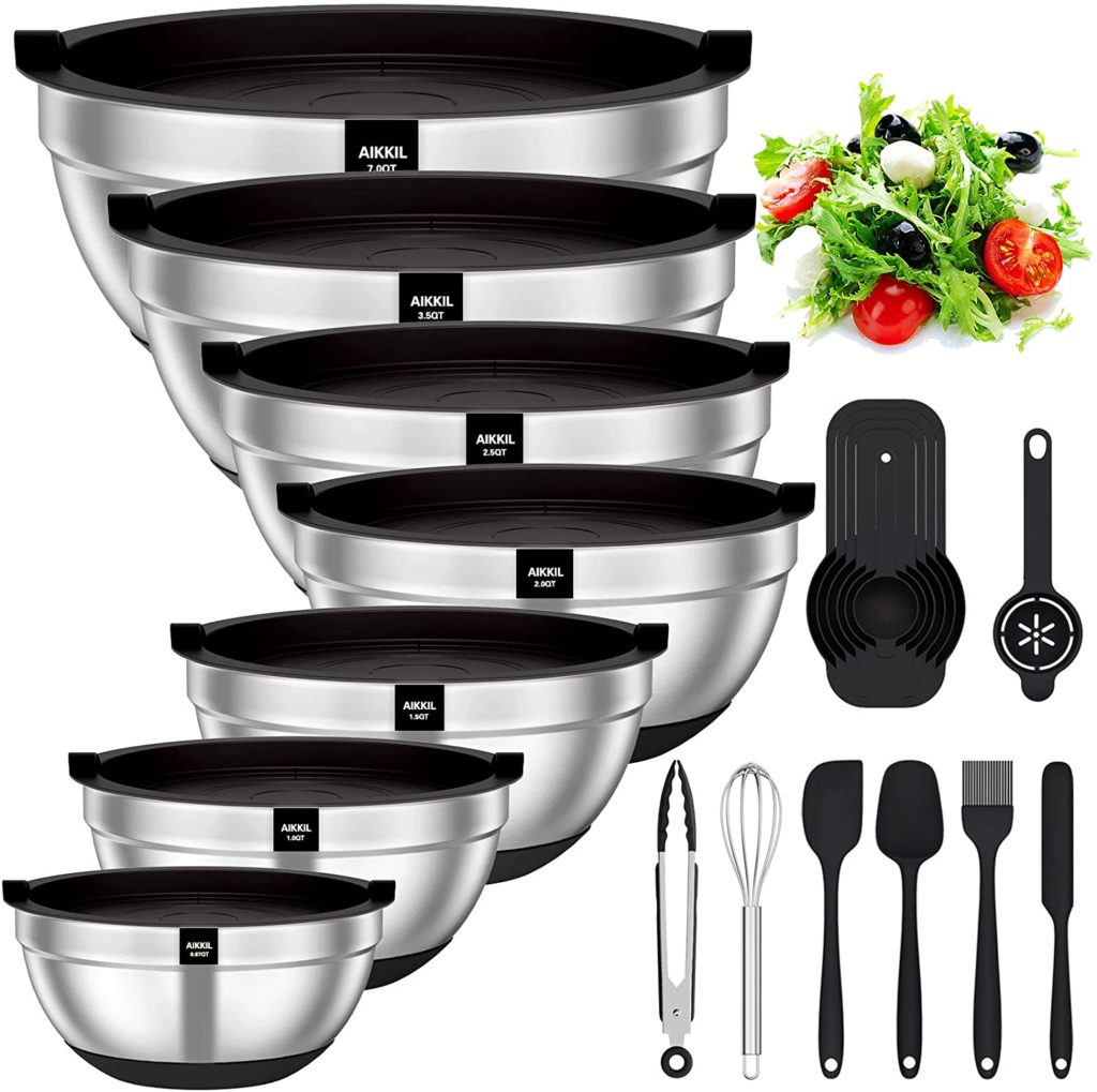 set of 7 stainless steel mixing bowls with black lids and black silicone utensils