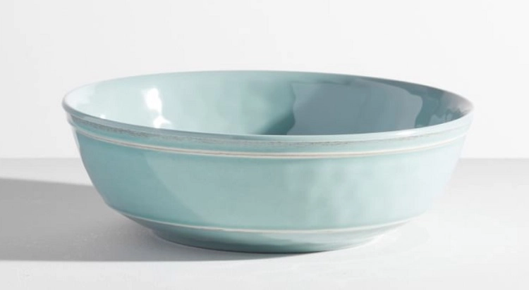 light blue melamine bowl with white details around rim