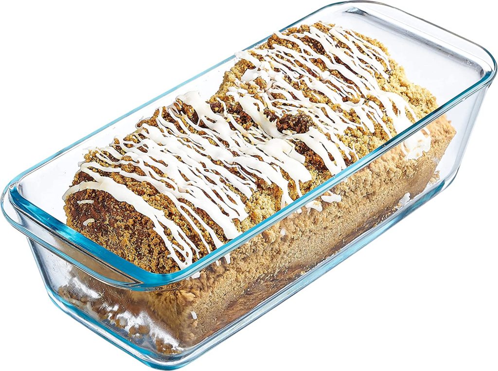 iced pumpkin bread loaf in clear glass loaf pan