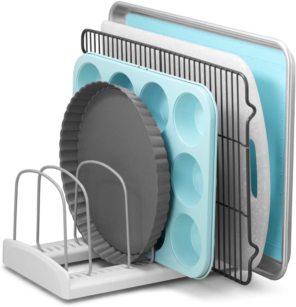 metal and light blue baking dishes in grey storage rack