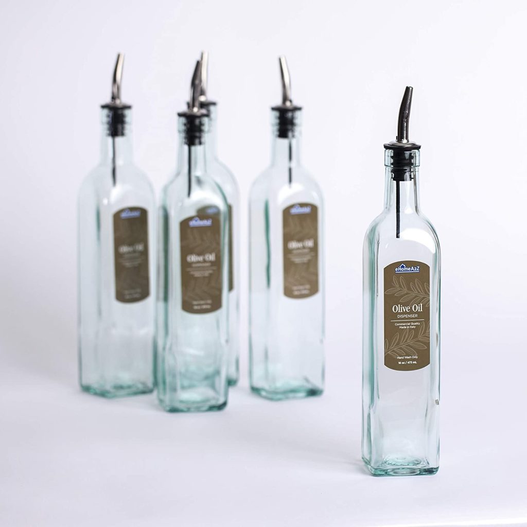 set of clear four olive oil dispensers with brown labels 