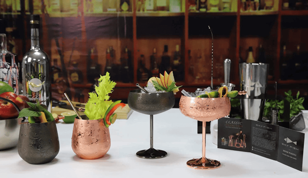 fancy cocktails in copper and metal glassware