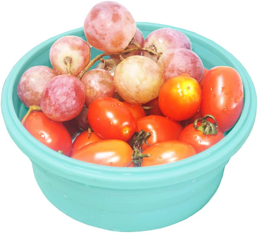 turquoise container filled with red grapes and tomatoes
