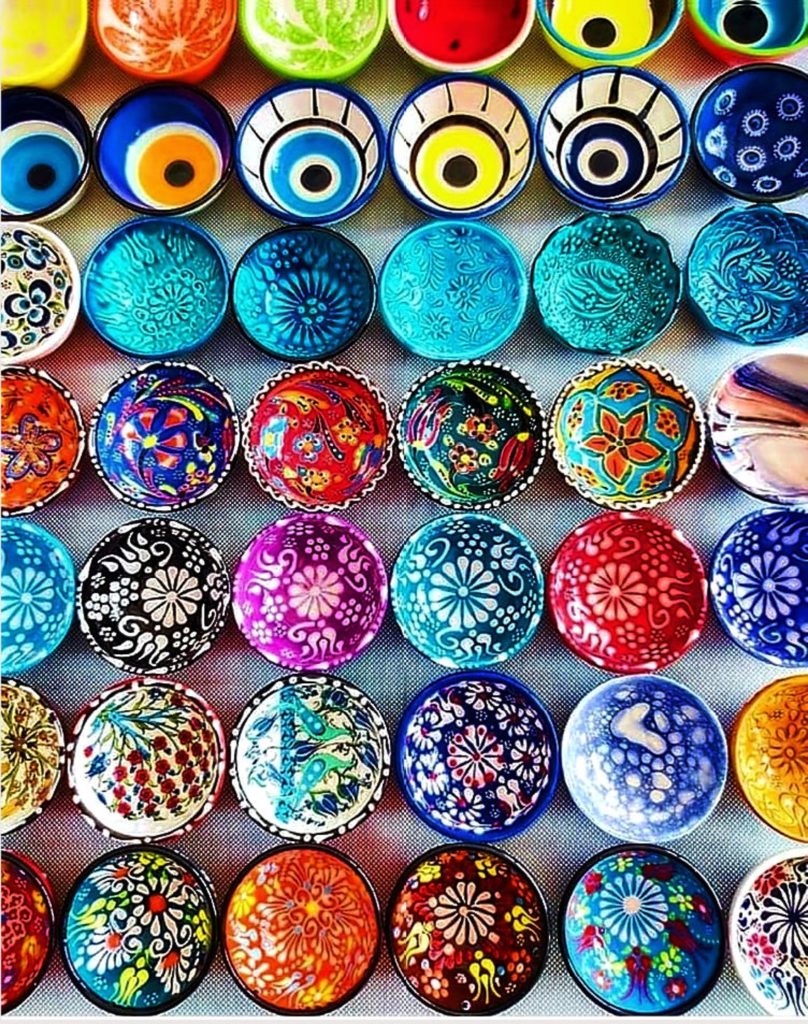 overhead image of collection of colorful and patterned ceramic bowls