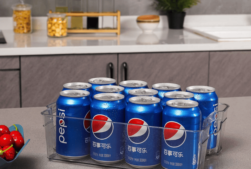 pepsi cans in clear organizer bin on counter