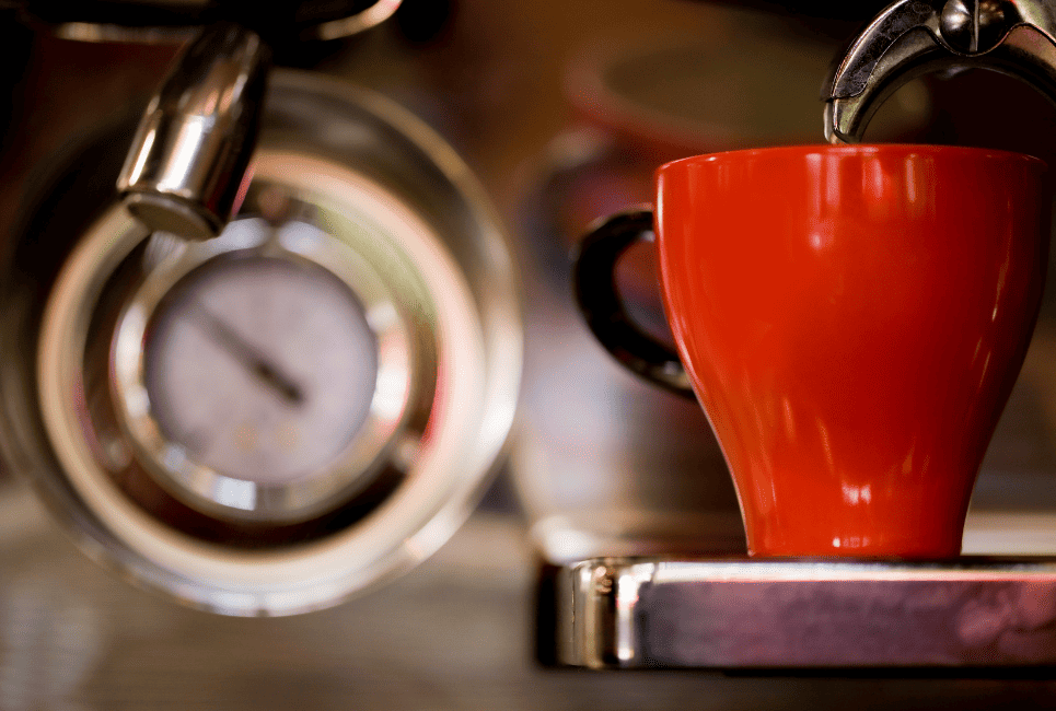 red coffee mug in focus