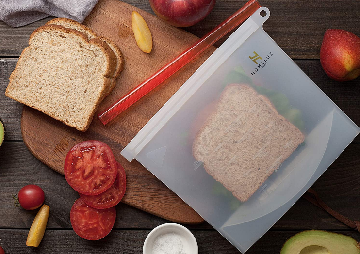 curring board with food and sandwich in reusable silicone bag