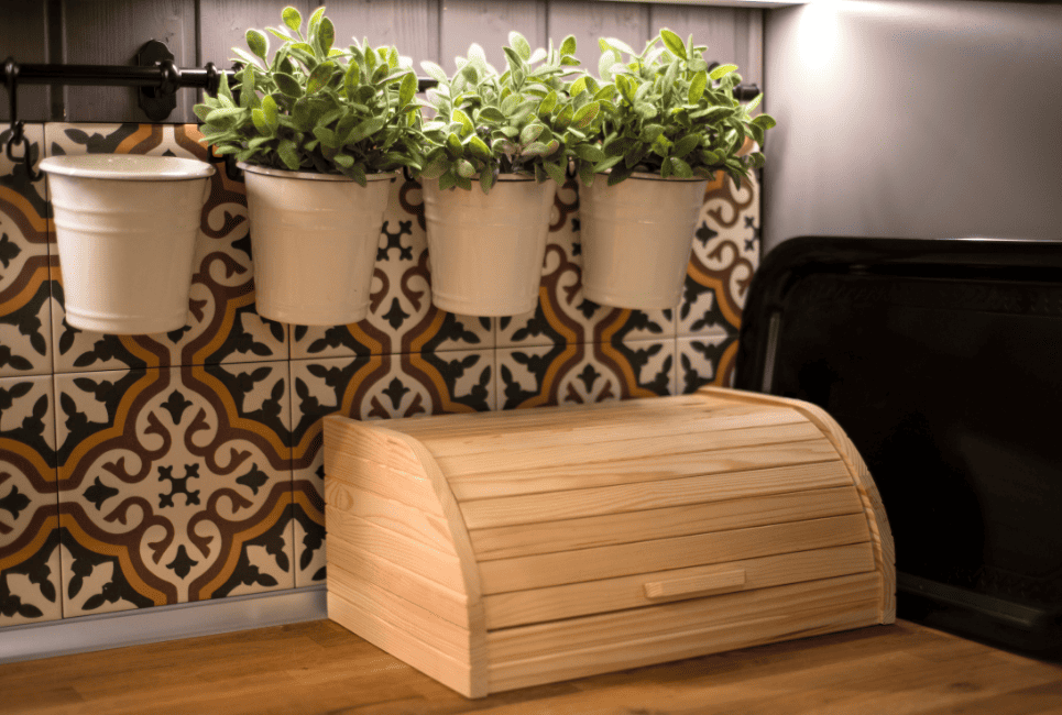 roll top breadbox on counter with stylish moroccan tiles