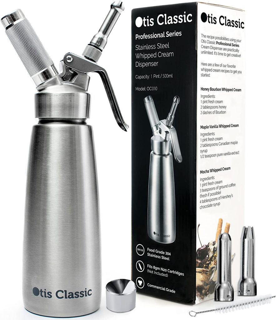 Stainless steel whipped cream dispenser with tips and Otis brand box