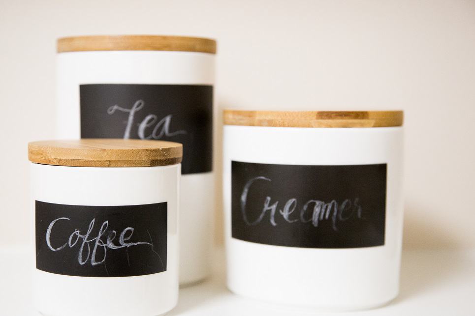 white ceramic canisters with chalk labels
