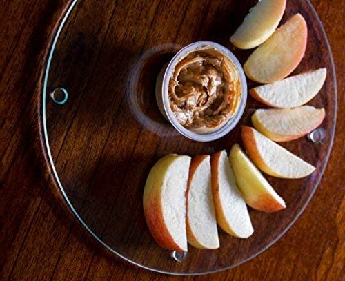 apple wedges and dip on glass cutting board