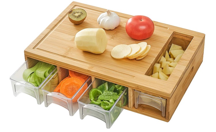 bamboo cutting board with pull out containers below and juice groove