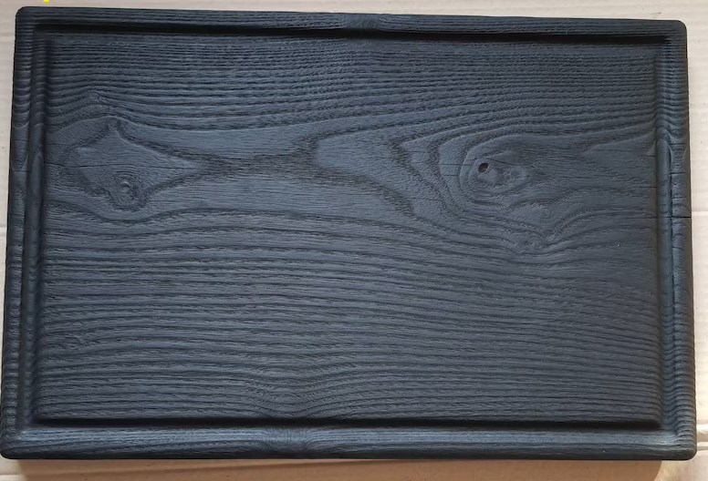 black wooden cutting board with juice groove