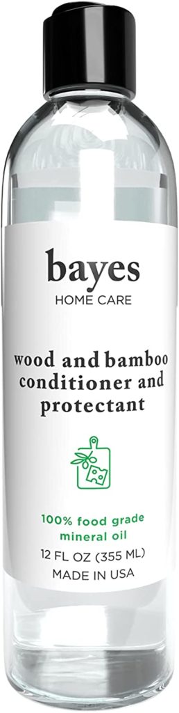 clear bottle of bayes brand wood conditioner