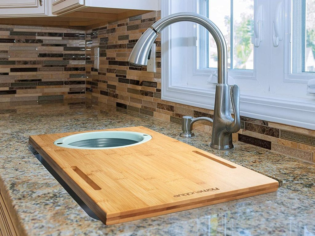 cutting board with strainer over sink in traditional kitchen
