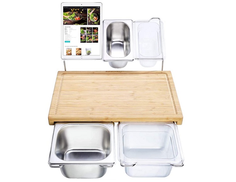 empty food prep station with cutting board, tablet, and containers