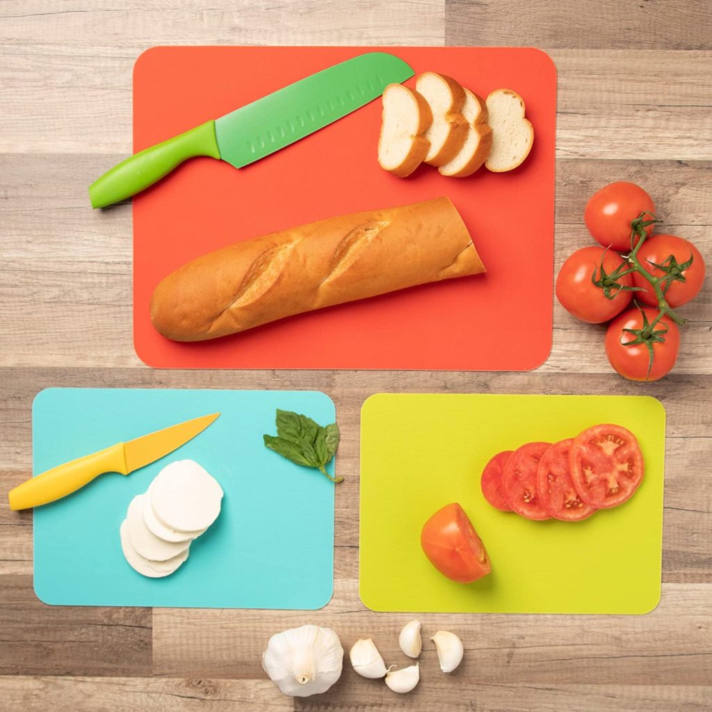 flat lay of colorful cutting boards with food on them