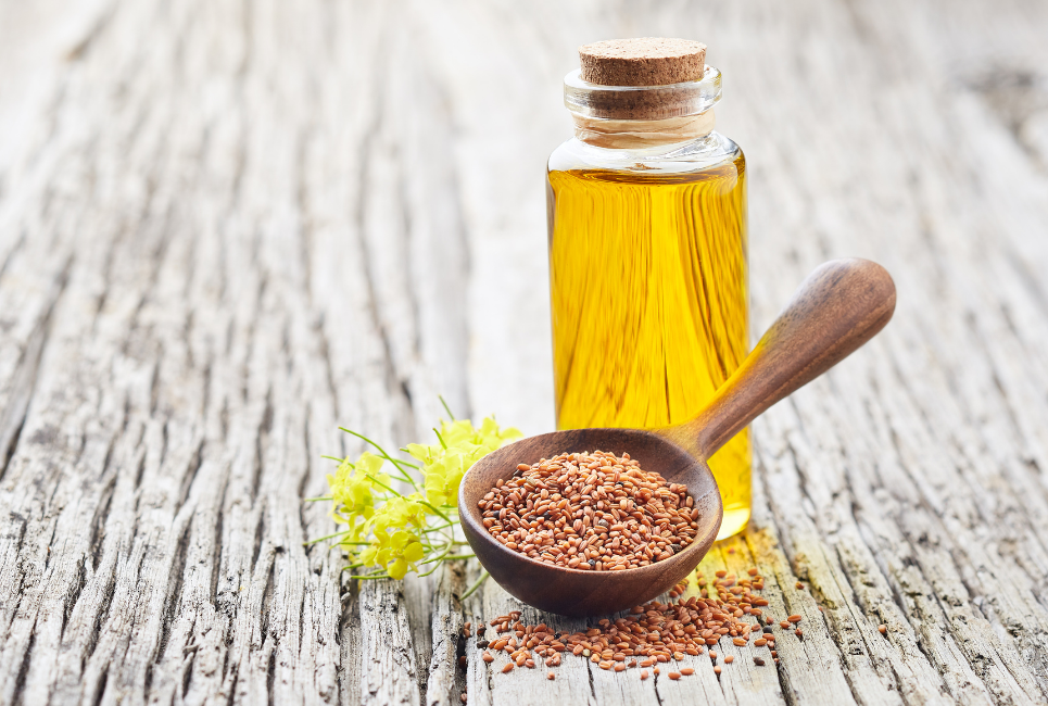 jar of olive oil and small bowl of mustard seeds