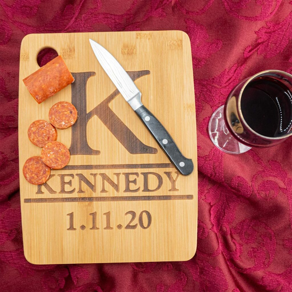 knife and sliced pepperoni on custom KENNEDY engraved cutting board