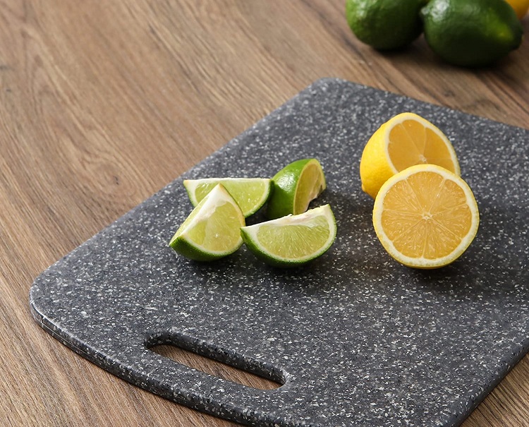 lemon and lime cut up on stone cutting board