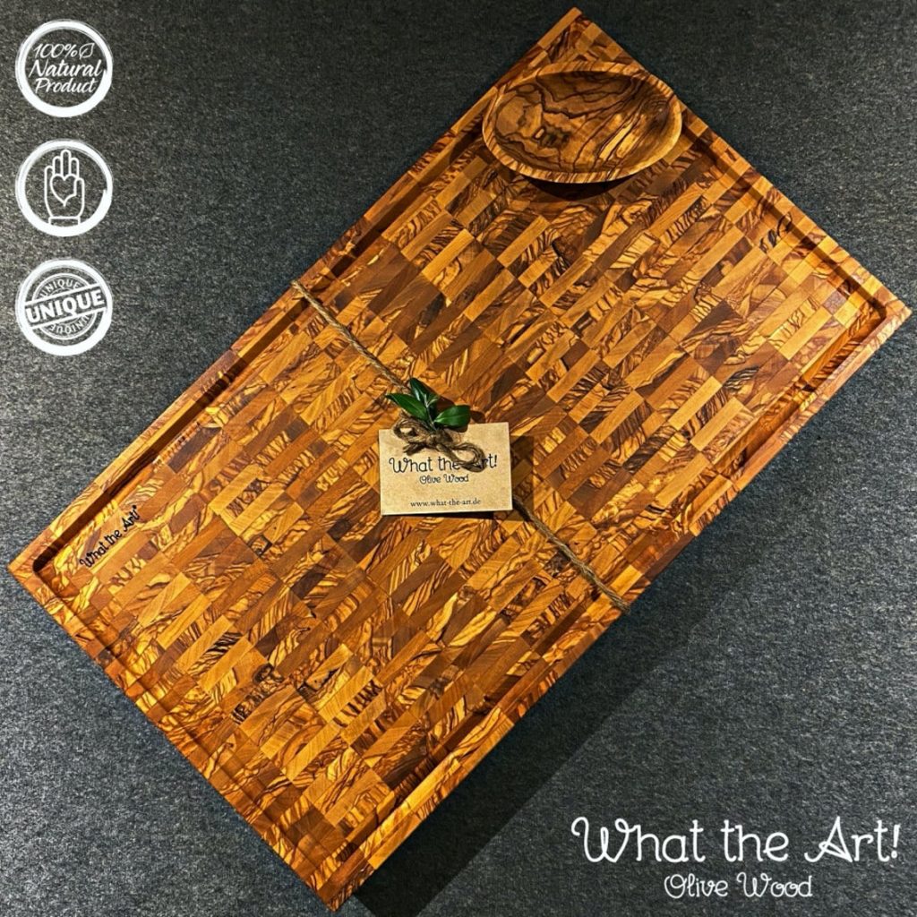 olive wood edge grain cutting board wrapped in branded twine
