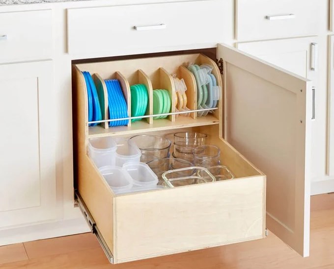 open cabinet in kitchen organized with tupperwares