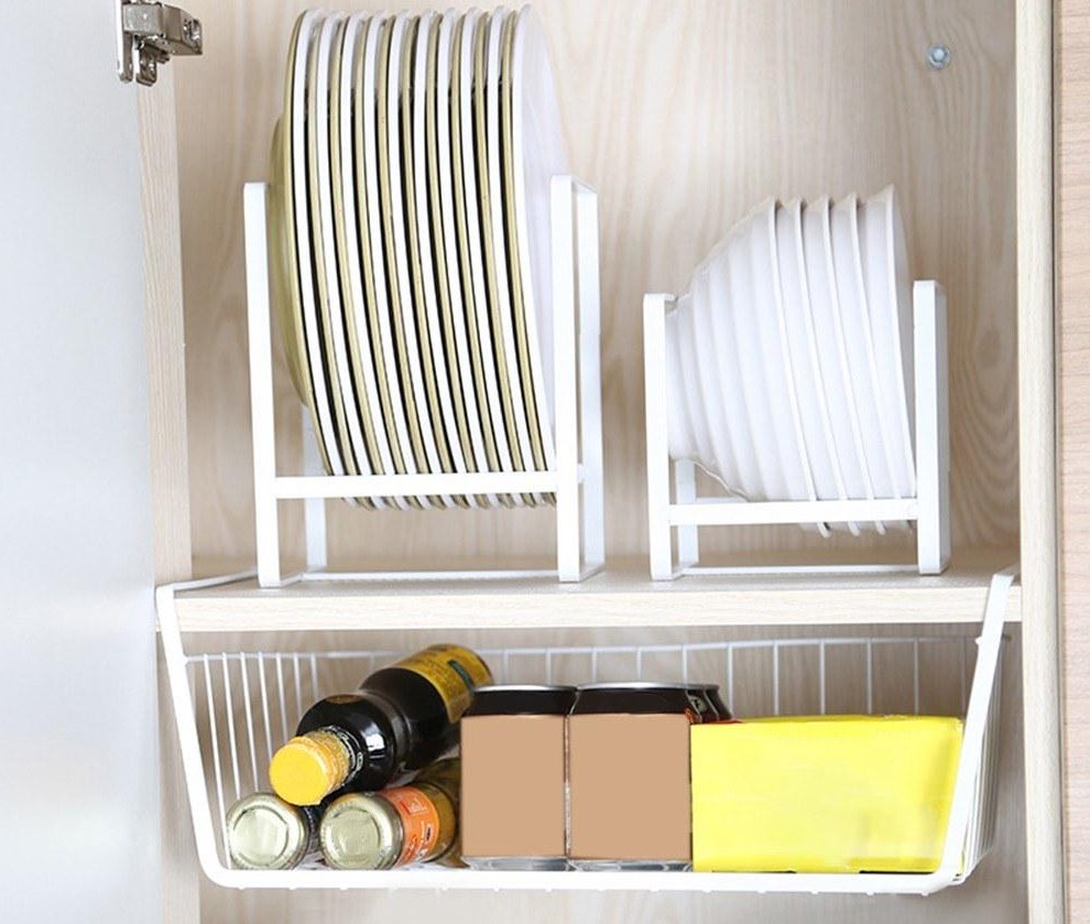 open cabinet with organizer full of plates and spices
