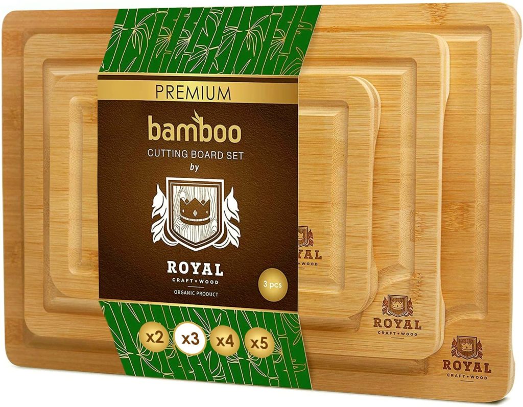 package of three bamboo cutting boards in sleeve packaging