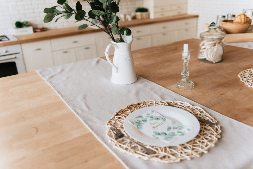 place setting and decor on butcher block countertop