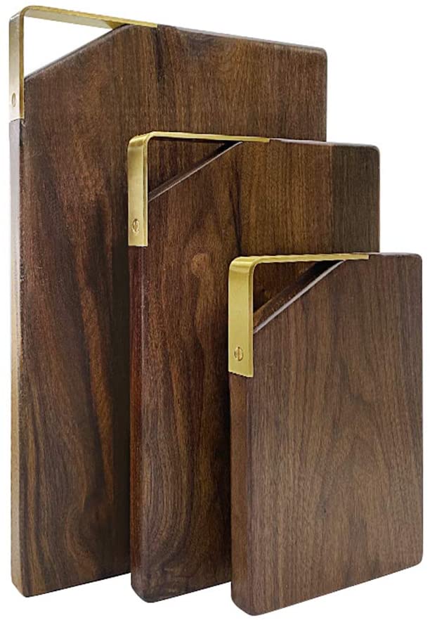 set of three walnut cutting boards with gold handle detail