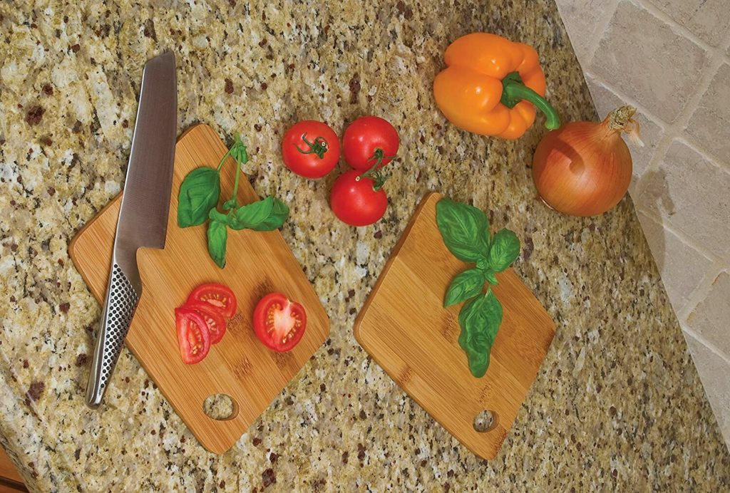 sliced tomatoes and basil on a trio of wooden cutting boards