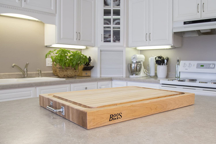 thick butcher block cutting board on modern clean counter