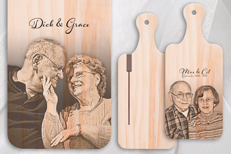 three cutting boards with handles customized with burnt in elderly couple