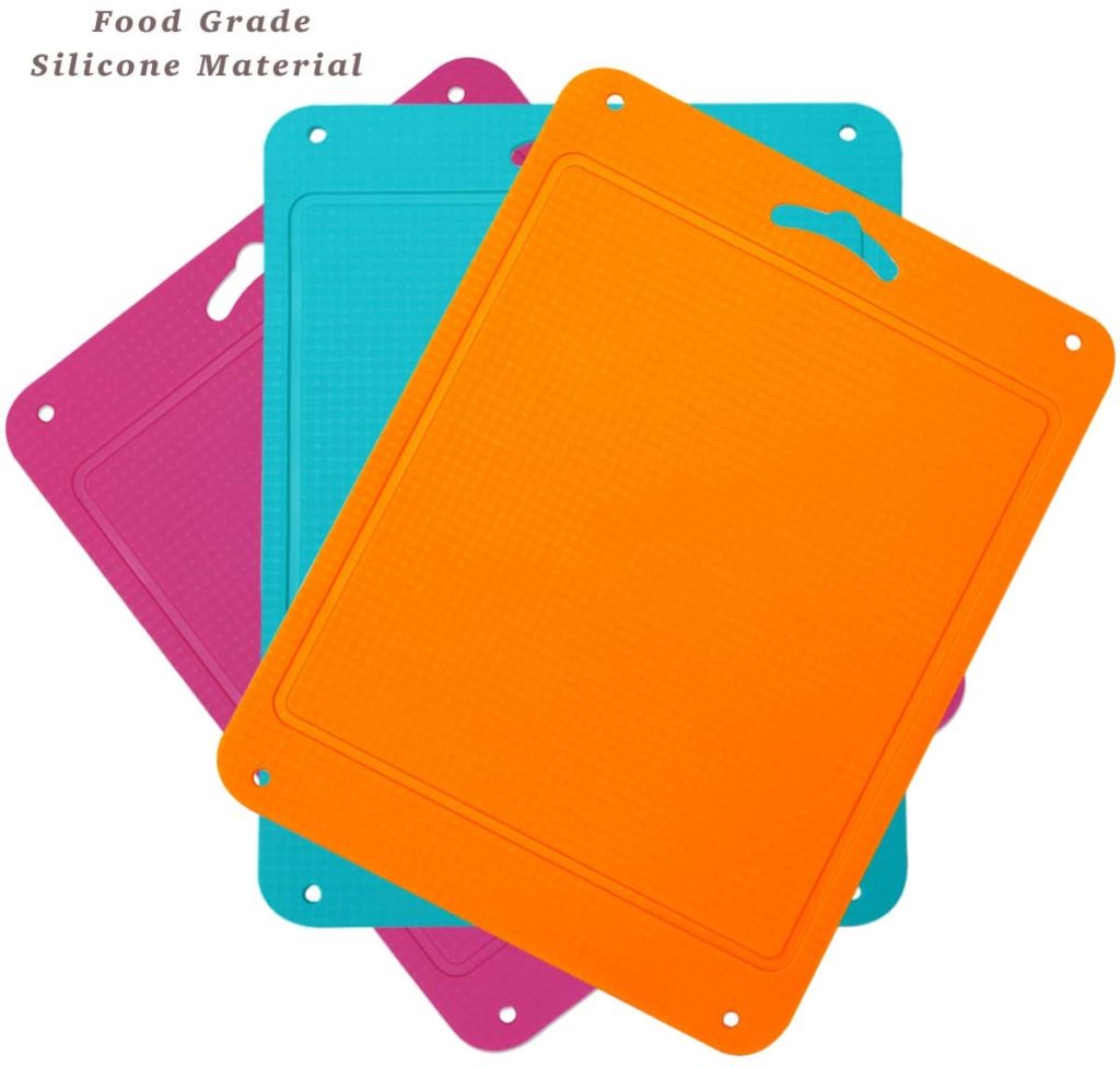 three silicone cutting boards in pink blue and orange