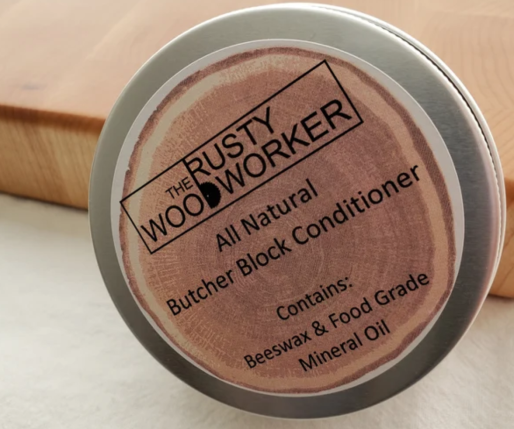 tin of butcher block conditioner wax with wood print on lid